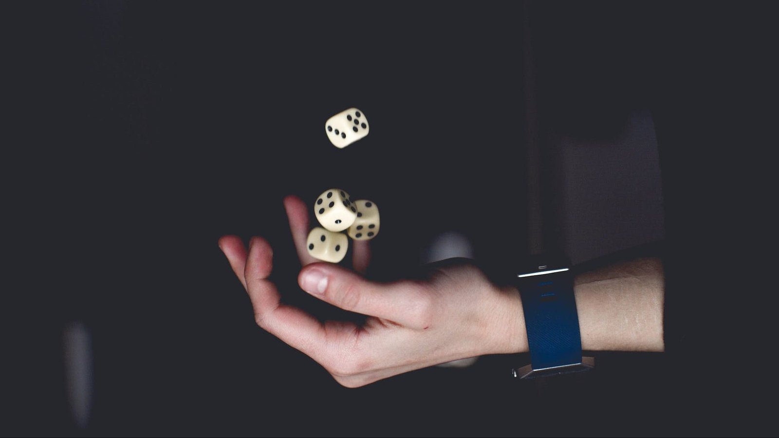 person about to catch four dices